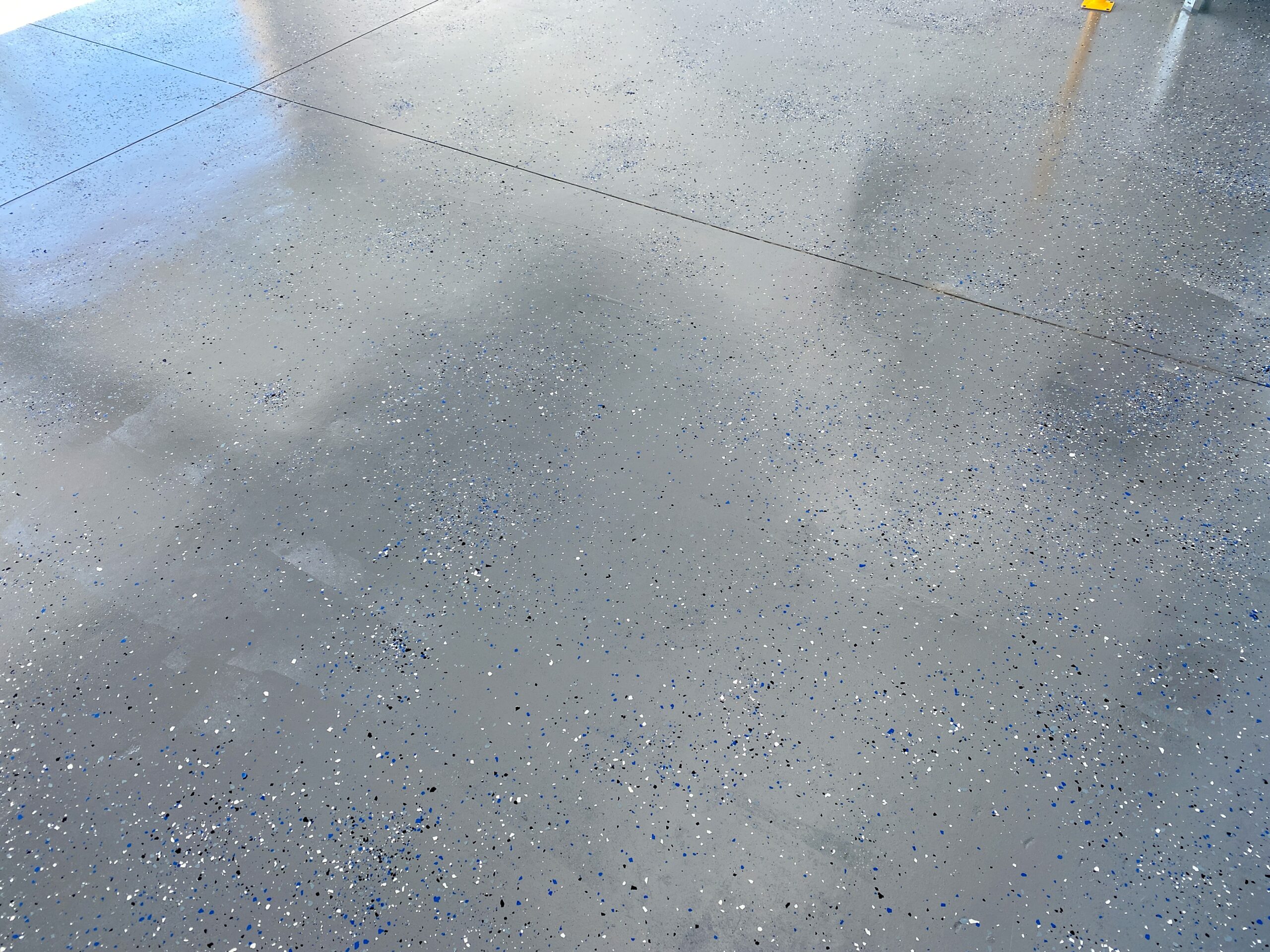 freshly applied gray epoxy flooring
